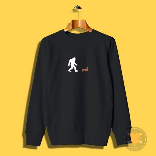 Bigfoot walking a daschund Sweatshirt